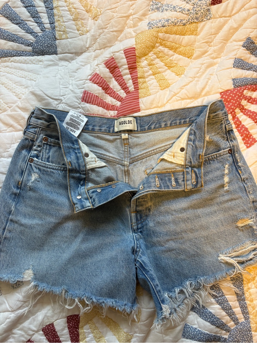 Agolde Light Blue Distressed Denim Cutoff Shorts